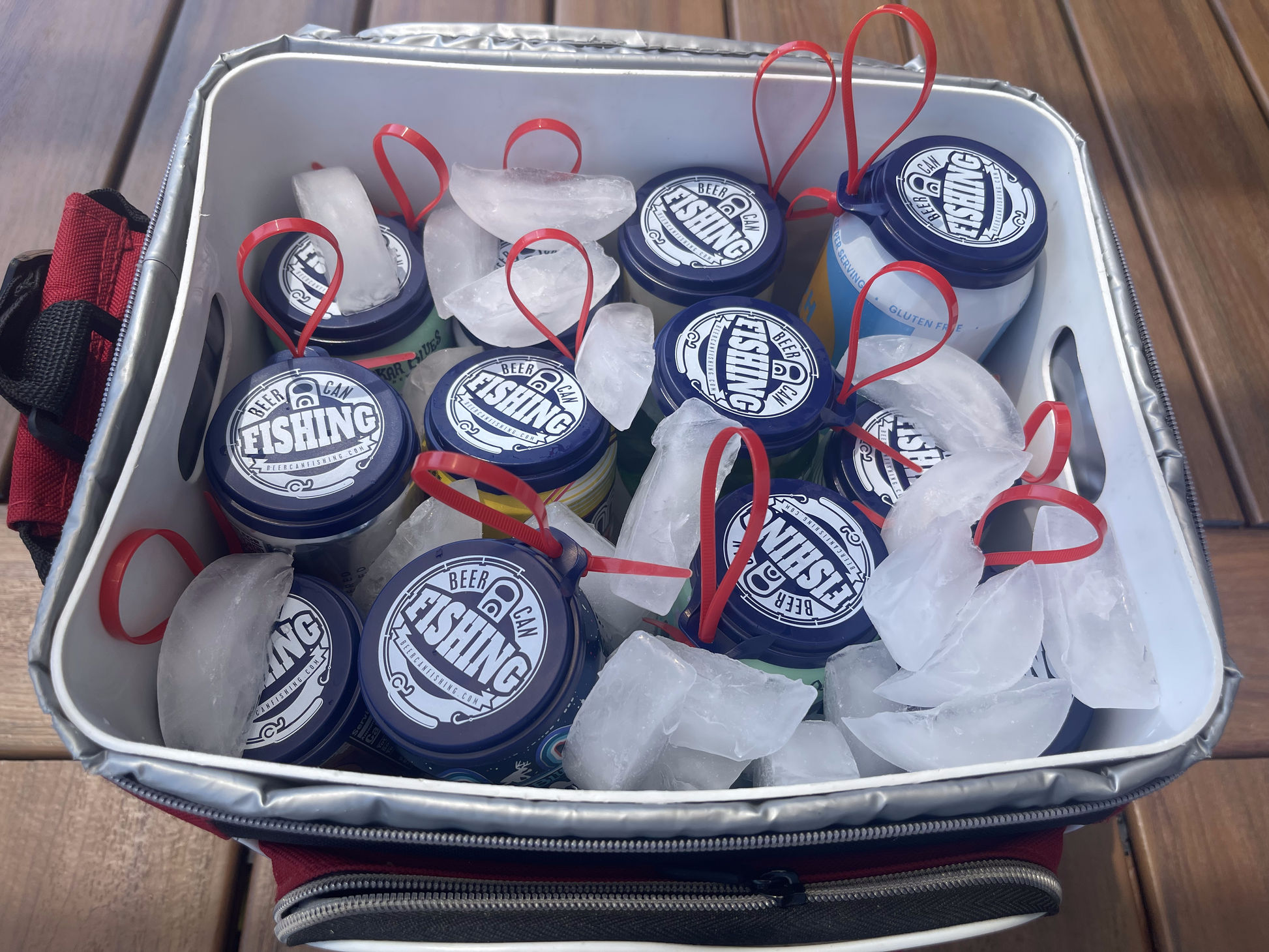12 pack of beer can fishing game lids in a cooler