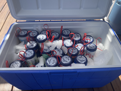 24 pack of beer can fishing game lids in a cooler